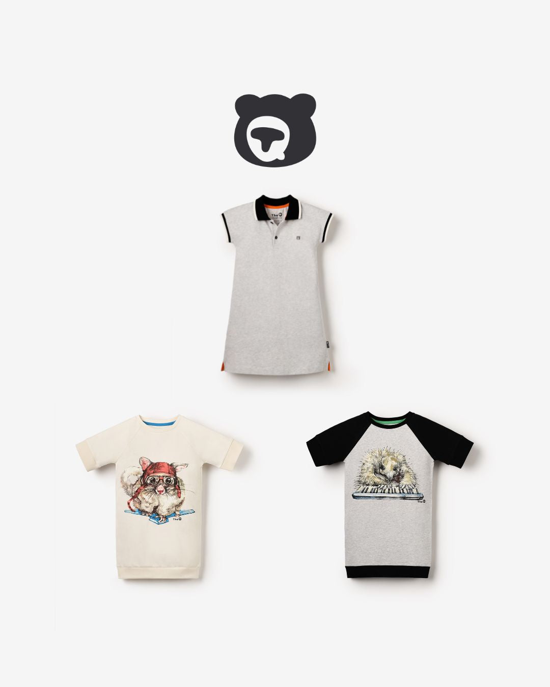 Bundle of three organic cotton girls’ dresses from The QT: grey polo dress, cream tunic with sugar glider, grey tunic with echidna playing the piano.